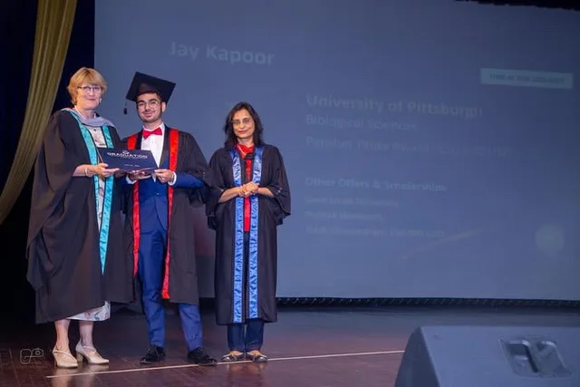 Jay on stage at his school graduation